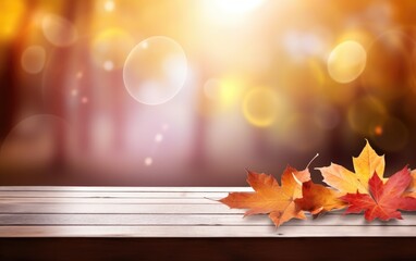 Wooden table and blurred Autumn background. Autumn yellow leaves banner