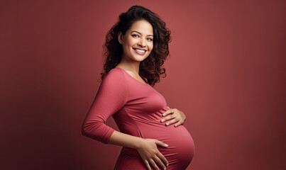 Expectant mother tenderly touching her baby bump. - obrazy, fototapety, plakaty
