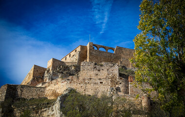 Detail view from below of the imposing Morella castle, Castellón, Spain, with midday light