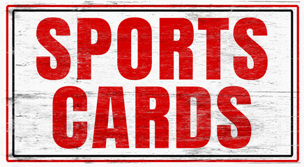 Old worn sports cards sign on wood