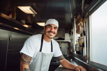 Fotobehang Latin American male chef preparing takeaway food in food truck kitchen © colnihko