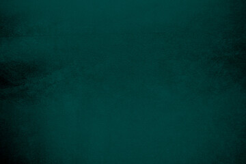 Dark green velvet fabric texture gradient used as background. Emerald color panne fabric background...