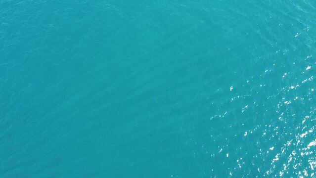 unrecognizable people on jetsky and a few boats