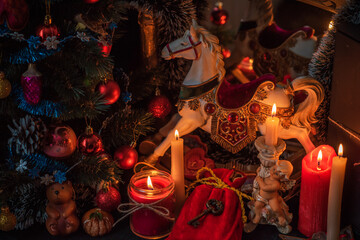 Christmas Candle lights in dark room. Concept of divination, oracle and predictions, rituals and other magic 
