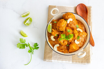 Indian Chicken Curry  Made with Cashew Paste Garnished with Lemon and Cilantro