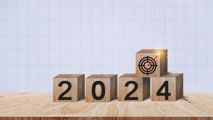 2024 goals of business or life, Wooden cubes with 2024 and goal icon on smart background, Starting...