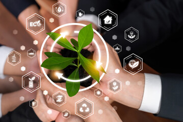 Business partnership nurturing or growing plant together with carbon icon symbolize ESG sustainable...