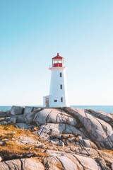 Vertical of Peggy's cove lighthouse on a rocky coastline in Scotia, Canada - obrazy, fototapety, plakaty