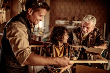 Father continues the legacy with his son in grandfather carpenter shop