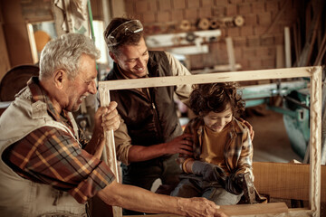 Father continues the legacy with his son in grandfather carpenter shop
