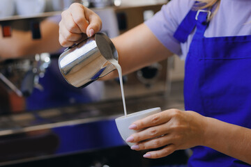 Process of making coffee, professional barista makes drink on coffeemachine in cafe