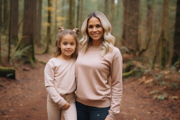 Naklejka premium A beautiful woman with her young daughters,