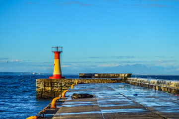 Obraz premium Colorful Kalk bay harbor lighthouse in cape town