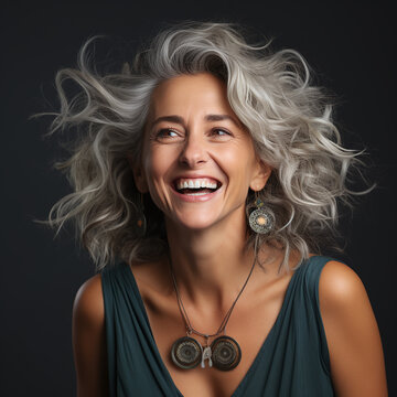 portrait of a middle aged woman with natural grey hair color 