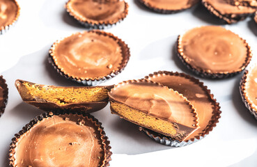 Peanut butter filled candy with chocolate frosting isolated on white background