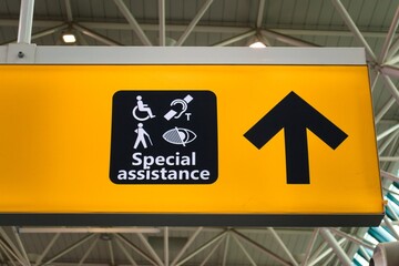 Signboard providing information for those in need of special assistance at the airport.