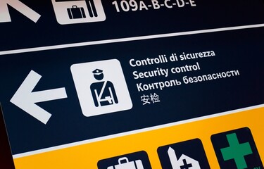 Security control at the airport, signboard in several languages. Public safety, airport signage concept. - obrazy, fototapety, plakaty