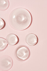 Liquid cream and cosmetic smudge drops texture on beige background. cosmetic smears cream texture