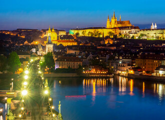 Obraz premium Prague cityscape with Charles bridge, Vltava river and Hradcany castle at night, Czech Republic