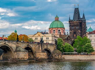 Fototapeta na wymiar Prague cityscape with Old Town Bridge Tower and Charles bridge over Vltava river, Czech Republic