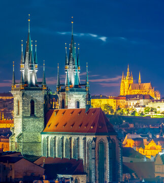 Prague cityscape at night with church of Our Lady before Tyn and Prague castle at background, Czech Republic