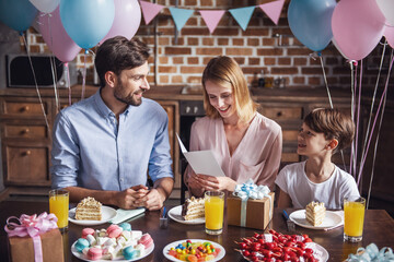Family celebrating birthday - Powered by Adobe