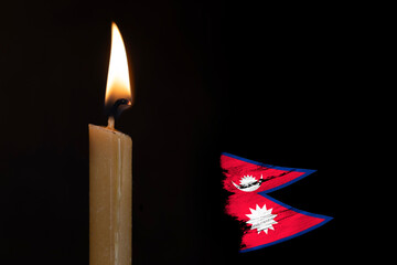 mourning candle burning front of flag Nepal, memory of heroes served country, grief over loss,...