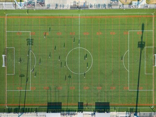 View of a soccer field in Canada, with players actively participating in a match © Wirestock