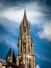 Vertical shot of Bristol High Cross under a blue cloudy sky in Stourton, England