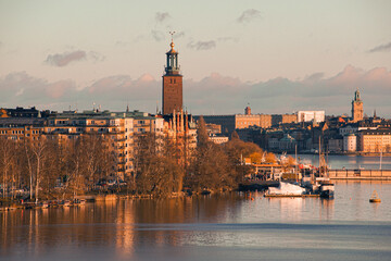 View of buildings at waterfront during sunset