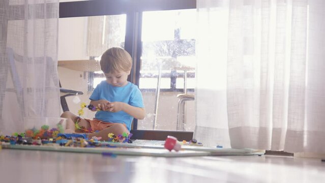 A Playful Scene: A Young Boy Engrossed in Imaginative Play