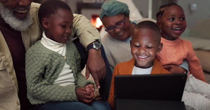 Tablet, family and grandparents with children at home to watch funny movie or video for e learning. African woman, man and kids together in lounge with tech for education, streaming or internet game