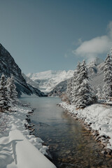 Winter's Whisper at Lake Louise: Fresh Snow Blankets the Unfrozen Waters