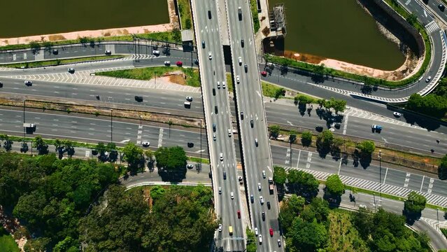 Footage of Cars Driving on Modern City Roads urban city traffic &ndash; transportation, infrastructure and mobility concept roundabout