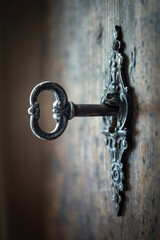 Old key in keyhole, macro shot. Gothic style. Key to knowledge. Concept and Idea for History,...
