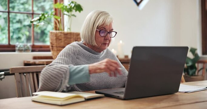 Senior, woman and writing with smartphone and laptop for planning, investment or schedule for retirement in living room. Elderly, person or notebook with technology and research at table in lounge