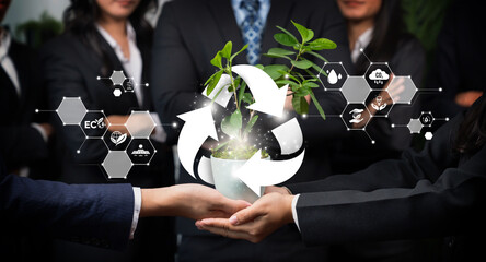 Business partnership nurturing or growing plant together with recycle icon symbolize ESG sustainable environment protection with eco recycling technology and recyclable resource management. Reliance