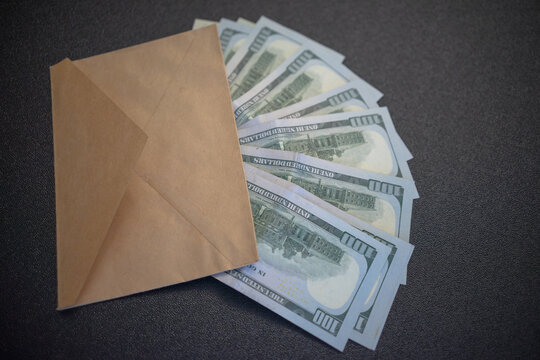 American dollars in a paper envelope. Salary in an envelope. Money set aside for vacation.