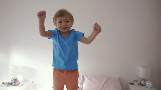 Jumping Joy: A Playful Little Boy Enjoying His Toys to the Fullest