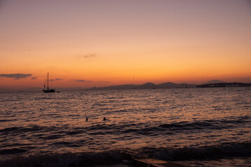 Fototapeta na wymiar Sunset over Glyfada beach in Athens, Attica, Greece - twilight over Aegean Sea