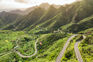 Aerial view of green volcanic landscape with mountain road in Tenerife - 672971183