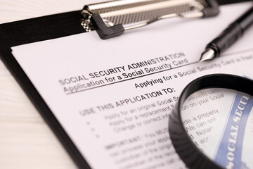 United States social security number cards lies on Application from social security administration...