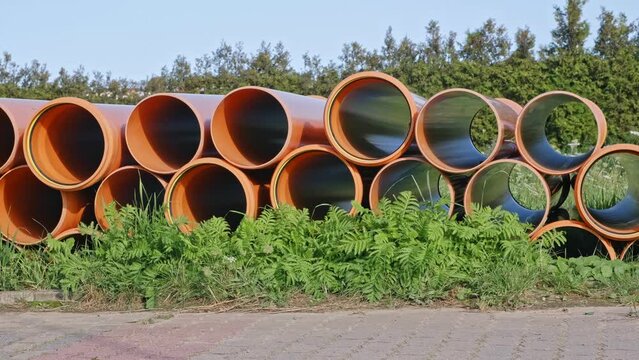 Industrial PVC Pipes Stacked at City ​Sewage System Construction Site 
