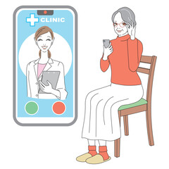スマートフォンでオンライン診療を受けるシニア女性