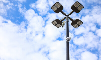 surveillance camera on a city street, symbolizing security and monitoring, framed against an urban backdrop with a neutral tone