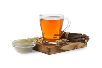 Aromatic licorice tea in cup, dried sticks of licorice root and powder isolated on white