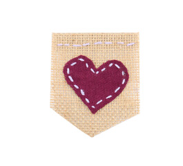 Piece of burlap fabric with heart isolated on white, top view