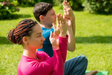 Obraz premium couple doing yoga exercises gestures poses