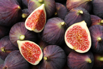 Fresh ripe figs as background, top view