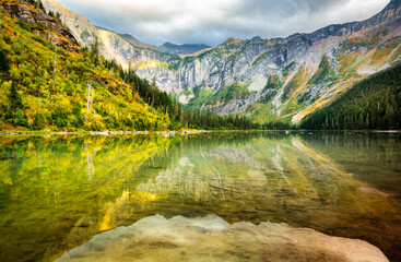 Avalanche Lake cliffs, basin, lake and waterfall in Glacier National Park, Montana. Avalanche Lake...